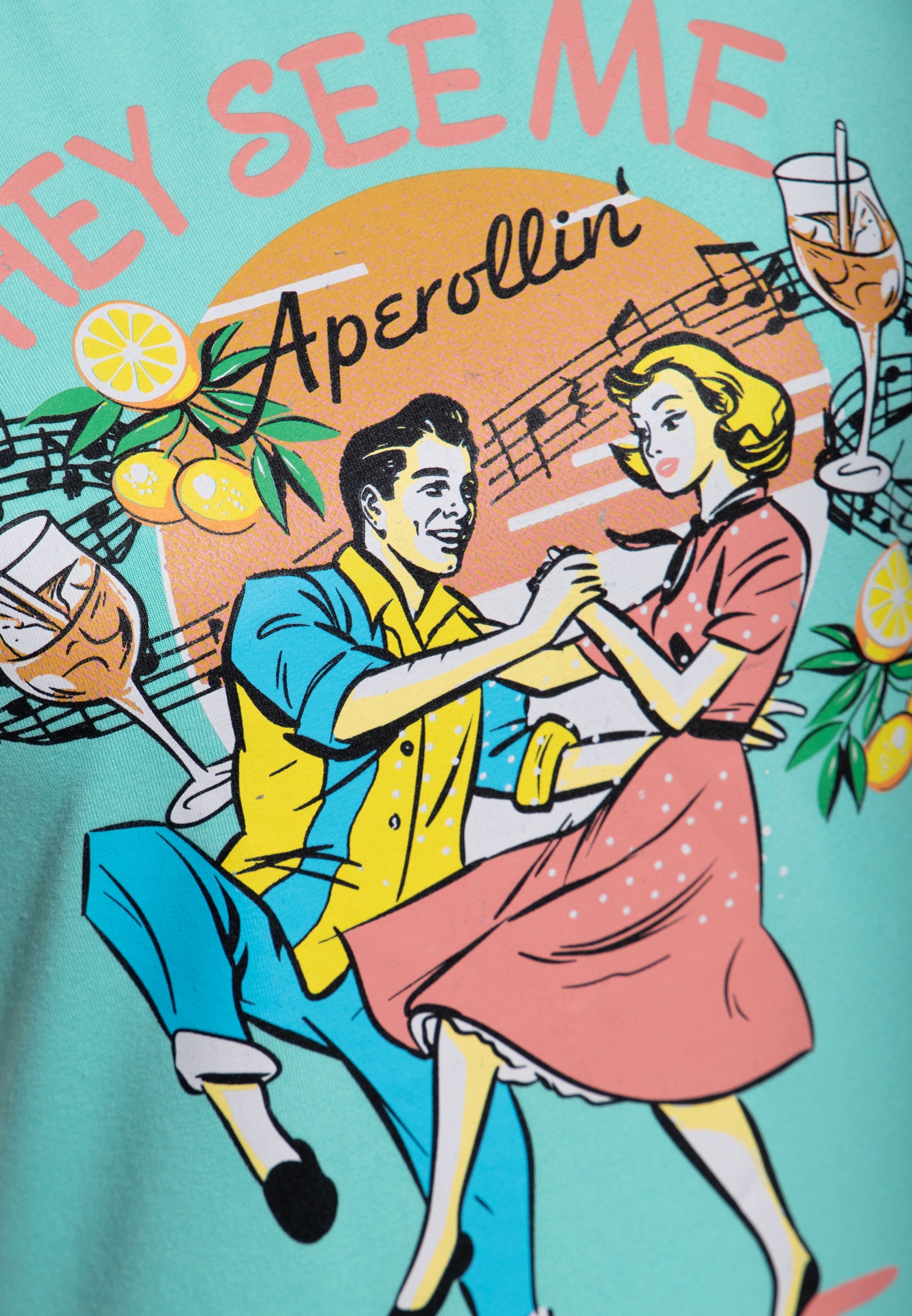 T-Shirt 'They See Me Aperollin'' in Mint T-Shirts von Queen Kerosin